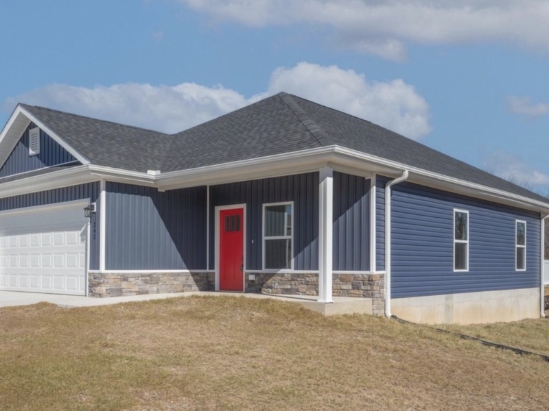 This brand new, move-in ready 3-bedroom, 2-bath home offers modern comfort with a stylish open-concept design. It features a kitchen with granite countertops, a spacious island, stainless steel appliances, and under-cabinet lighting. The two-car garage provides convenience and storage. Located conveniently near Joplin and Northwest Arkansas, it offers quick access to shopping, dining, and employment centers, all while being more affordable. This home is perfect for those seeking value, comfort, and convenience.