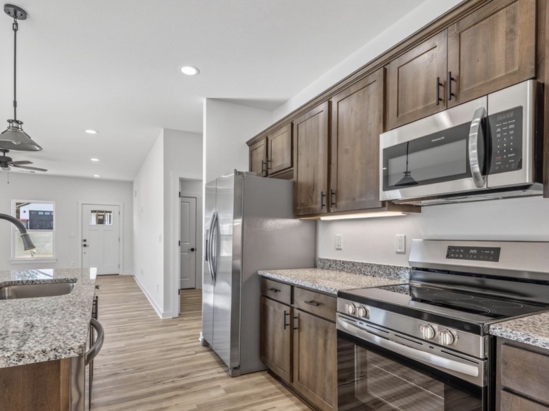 Enjoy stylish comfort and everyday convenience in this thoughtfully crafted three-bedroom, two-bathroom home, designed for families embracing a modern lifestyle. The open-concept floor plan unites the living area, dining room, and kitchen, offering the perfect setting for entertaining guests or spending time together. Each bedroom is spacious and filled with abundant natural light, providing serene spaces for rest and relaxation. With 1,369 square feet of intelligently organized living space, this contemporary family residence offers the style, practicality, and generous room today’s buyers expect. 