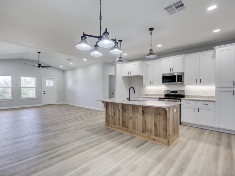 Discover your ideal home with this spacious three-bedroom, two-bathroom property, perfectly designed for modern family living. The open floor plan seamlessly blends the living, dining, and kitchen areas, creating a welcoming environment for entertaining guests and enjoying daily life. Each bedroom offers generous space and natural light, while the master suite provides a private retreat for relaxation. With 1,646 square feet of well-planned living space, this home is an exceptional choice for families seeking comfort, functionality, and style.